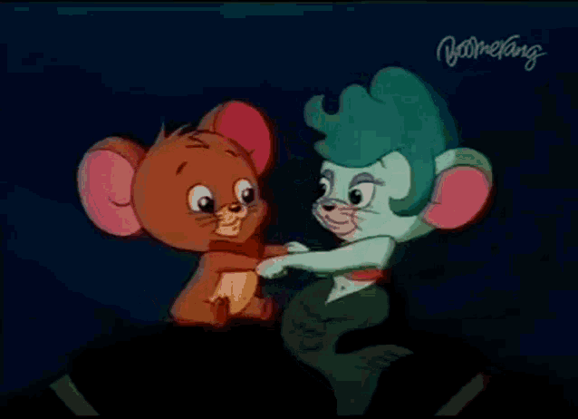 a cartoon of jerry and a mermaid with boomerang written on the bottom right