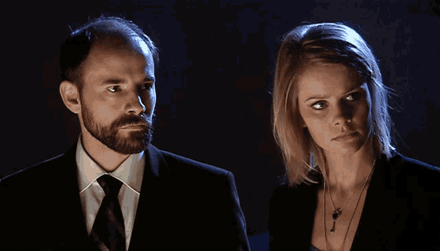 a man and a woman standing next to each other