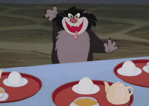 a cartoon cat is sitting at a table with cups and a teapot