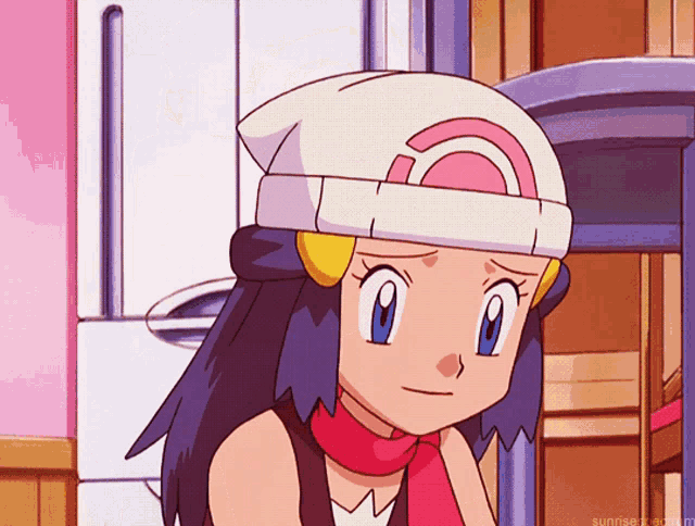 a girl wearing a white hat with a pink rainbow on it