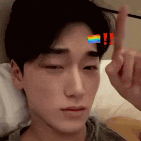 a close up of a person 's face with a rainbow flag on it .