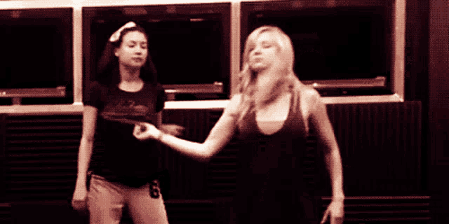 a girl with the number 8 on her shorts is dancing