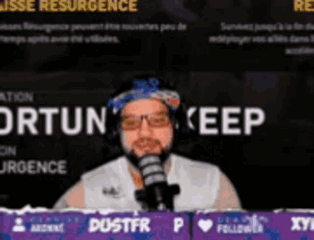a man wearing glasses and a bandana is standing in front of a microphone with the words " fortune keep " on the screen