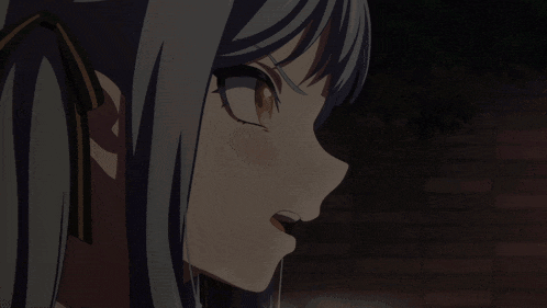 a close up of a girl 's face with a surprised expression on her face