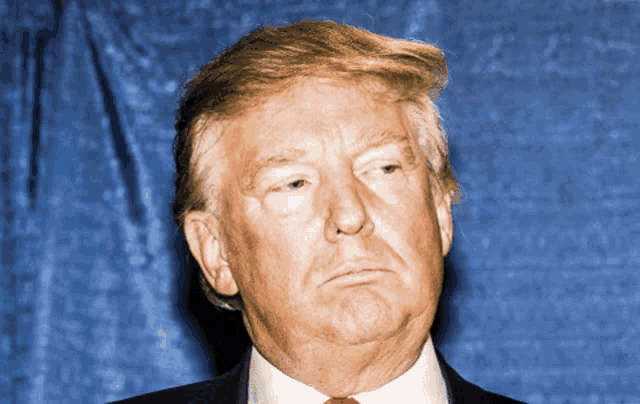 a close up of donald trump with a blue background