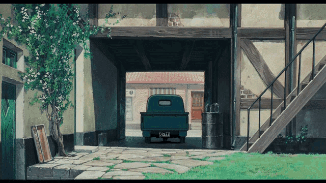 a green truck is parked in a garage with a license plate that starts with the letter c