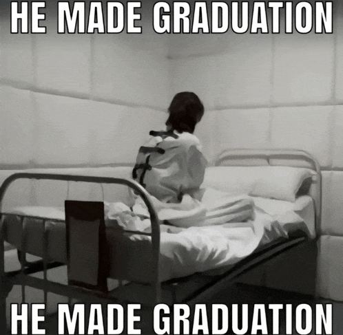 a man in a straight jacket is sitting in a hospital bed with the caption he made graduation he made graduation
