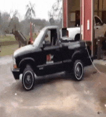 a black truck with the letter h on the side