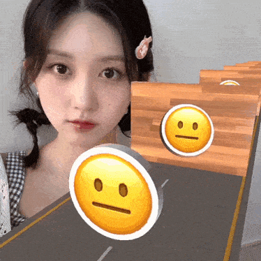 a girl with a smiley face on her head