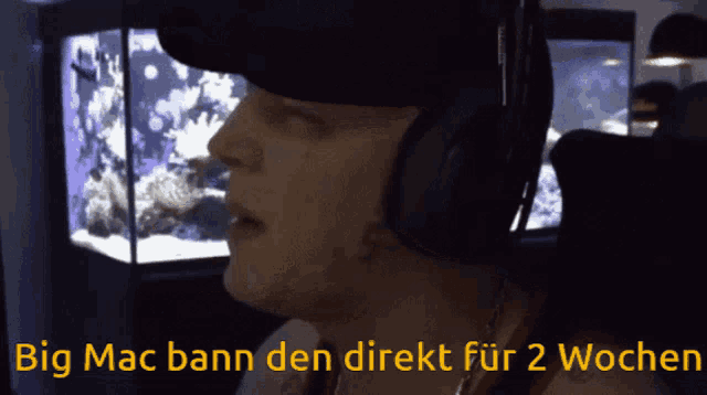 a man wearing headphones with the words big mac bann den direkt fur 2 wochen below him