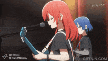 a girl with red hair is singing into a microphone while a girl with blue hair looks on