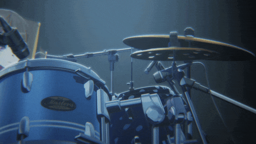 a blue masters drum set with a person playing it