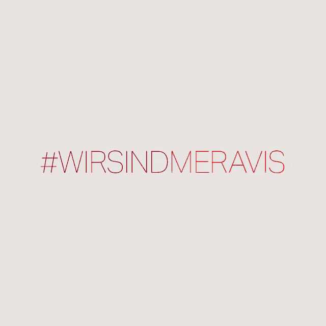 a sign that says #wirsind meravis in red letters