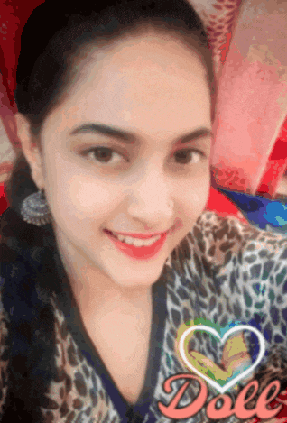 a girl with a leopard print shirt is smiling and has a heart in the background that says doll