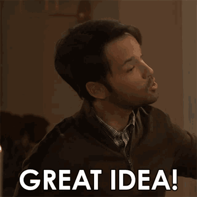 a man in a brown sweater is smiling and saying great idea .