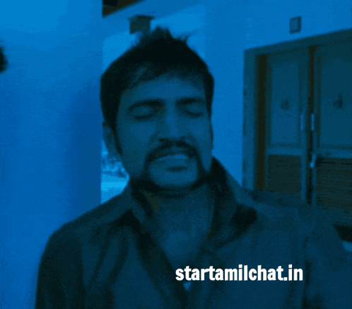 a man is covering his face with his hand and the website starttamilchat.in is visible