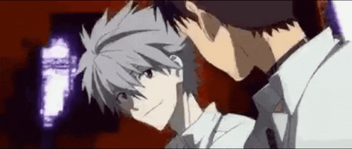 a couple of anime characters are standing next to each other in a room .