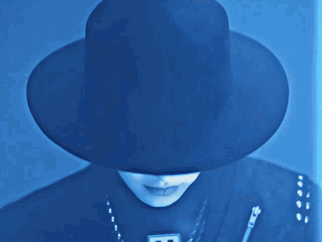 a close up of a person wearing a hat