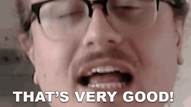 a man wearing glasses and a beard is saying `` that 's very good '' .