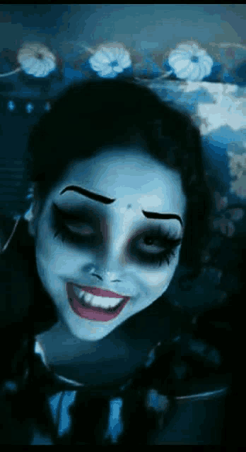 a woman with makeup on her face is smiling