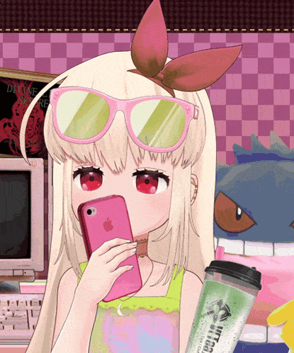 a girl wearing pink sunglasses is holding a pink phone