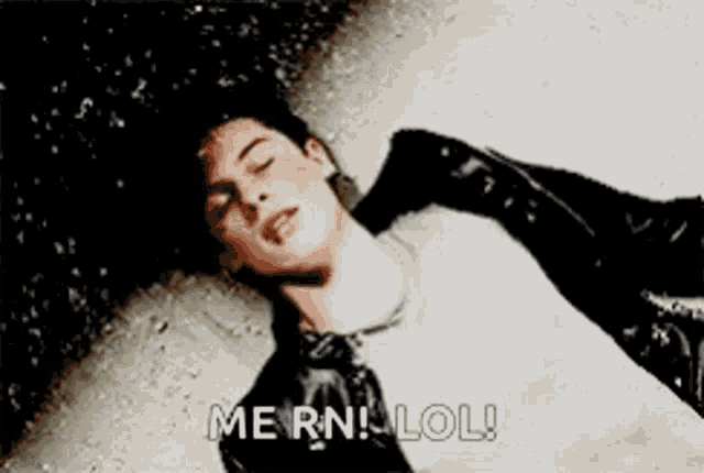 a man is laying on the ground with his eyes closed and the words `` me rn lol '' written next to him .