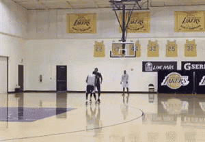 a basketball court with a banner that says lakers