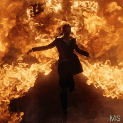 a person is surrounded by flames and the letters ms are on the bottom right