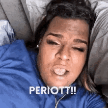a woman in a blue shirt is laying on a couch and making a funny face with the words periodt !
