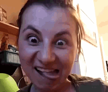 a close up of a woman 's face with a basket in the background