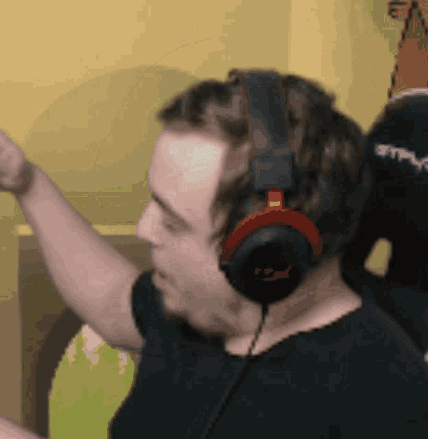a man wearing a pair of headphones with the word hyper on them