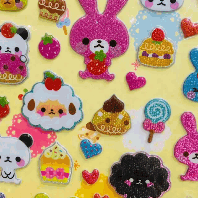 a yellow background with a bunch of stickers on it including a pink bunny