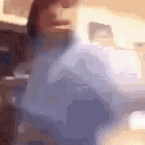 a blurry picture of a person standing in a room
