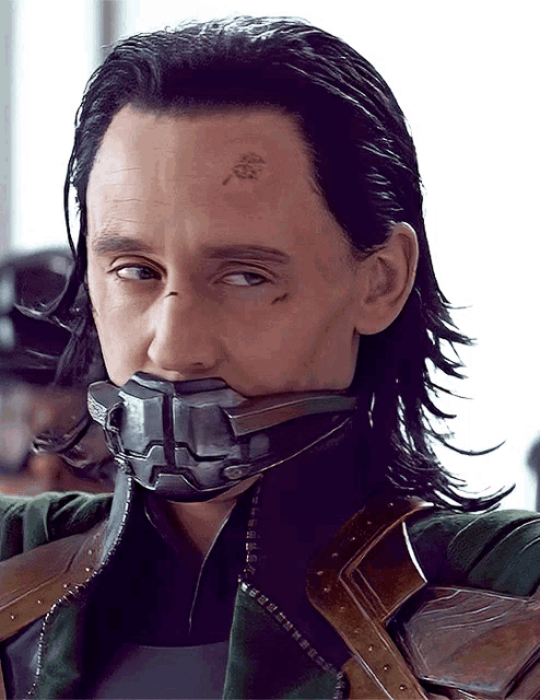 a close up of a man 's face with a mask on