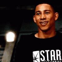 a man is wearing a black shirt that says star on it