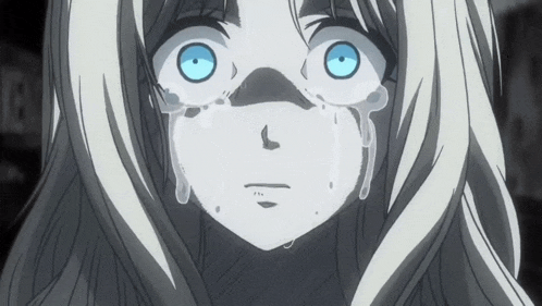 a close up of a girl 's face with tears coming out of her eyes