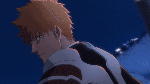 a close up of a man with orange hair and a white shirt