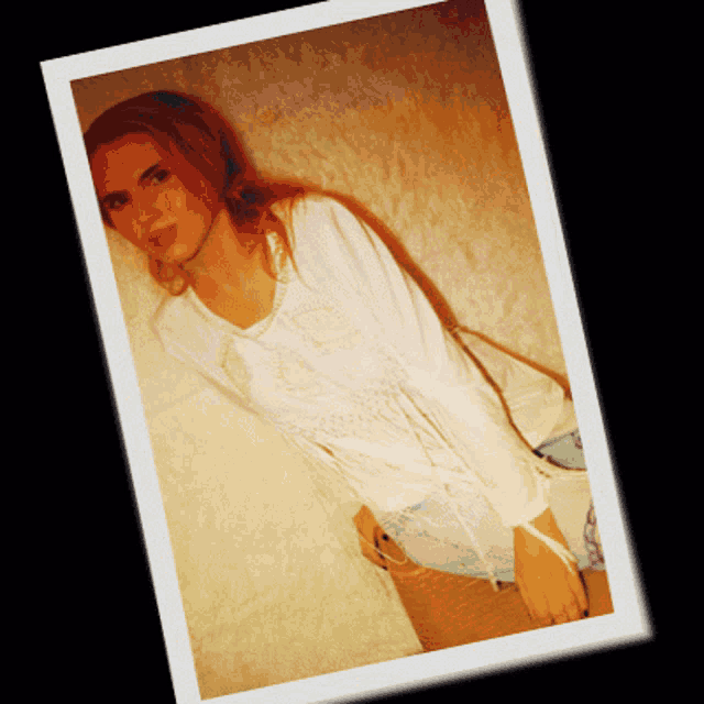 a picture of a woman in a white shirt