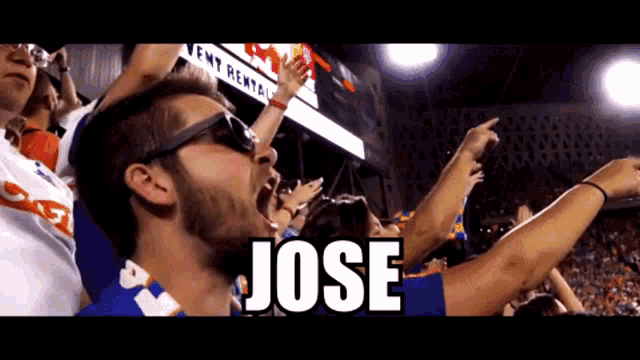 a man wearing sunglasses and a shirt that says jose