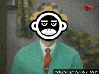 a man in a green jacket and tie with a monkey face on his face
