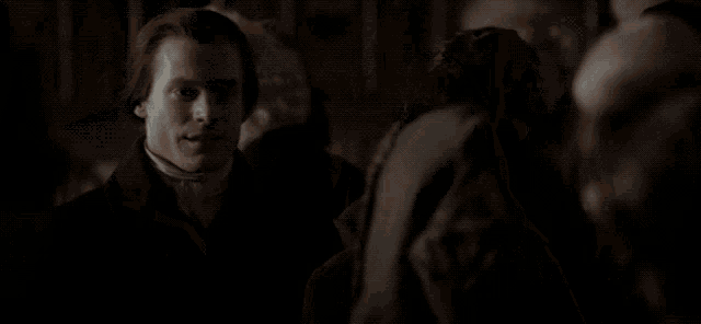 a blurred image of a person 's face in the dark