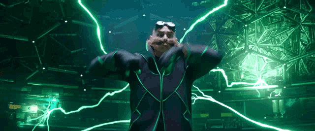 a man in a black suit is surrounded by green lightning strikes