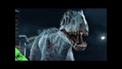 a dinosaur with its mouth open is standing in the dark .