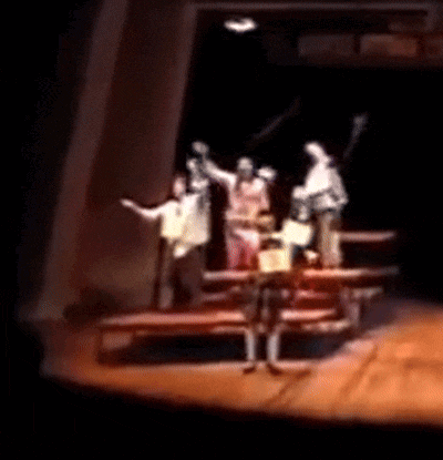a blurry photo of a group of people on a stage