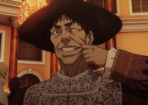 a man in a hat is making a face with his finger