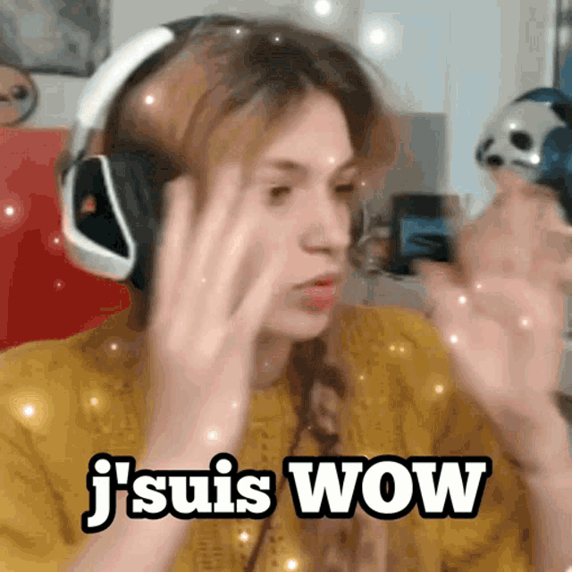 a woman wearing headphones says " j suis wow "
