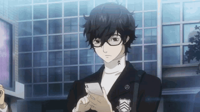 a man wearing glasses is looking at a phone