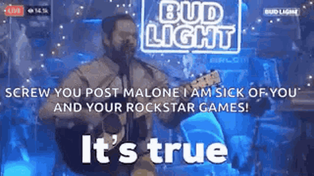 a man is singing into a microphone while playing a guitar .