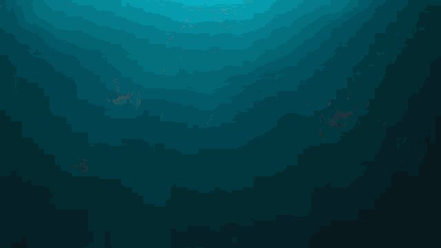 a person is swimming in the ocean with a red head
