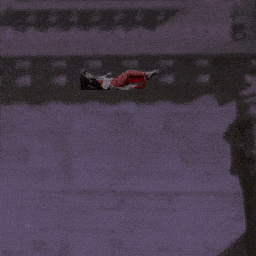 a man in a blue and silver outfit is standing on a flying carpet